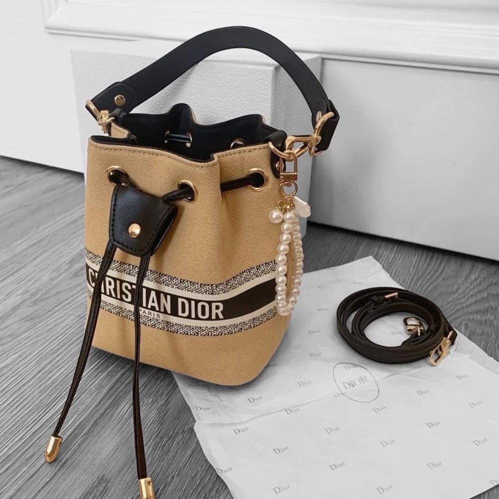 Dior Beige Canvas Mini Bucket Bag with Black Trim and Pearl Charm